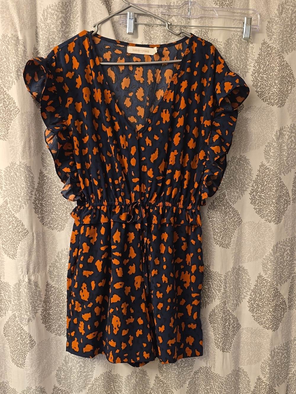bishop + young Navy and Orange Ruffle Sleeve V‑Neck Romper